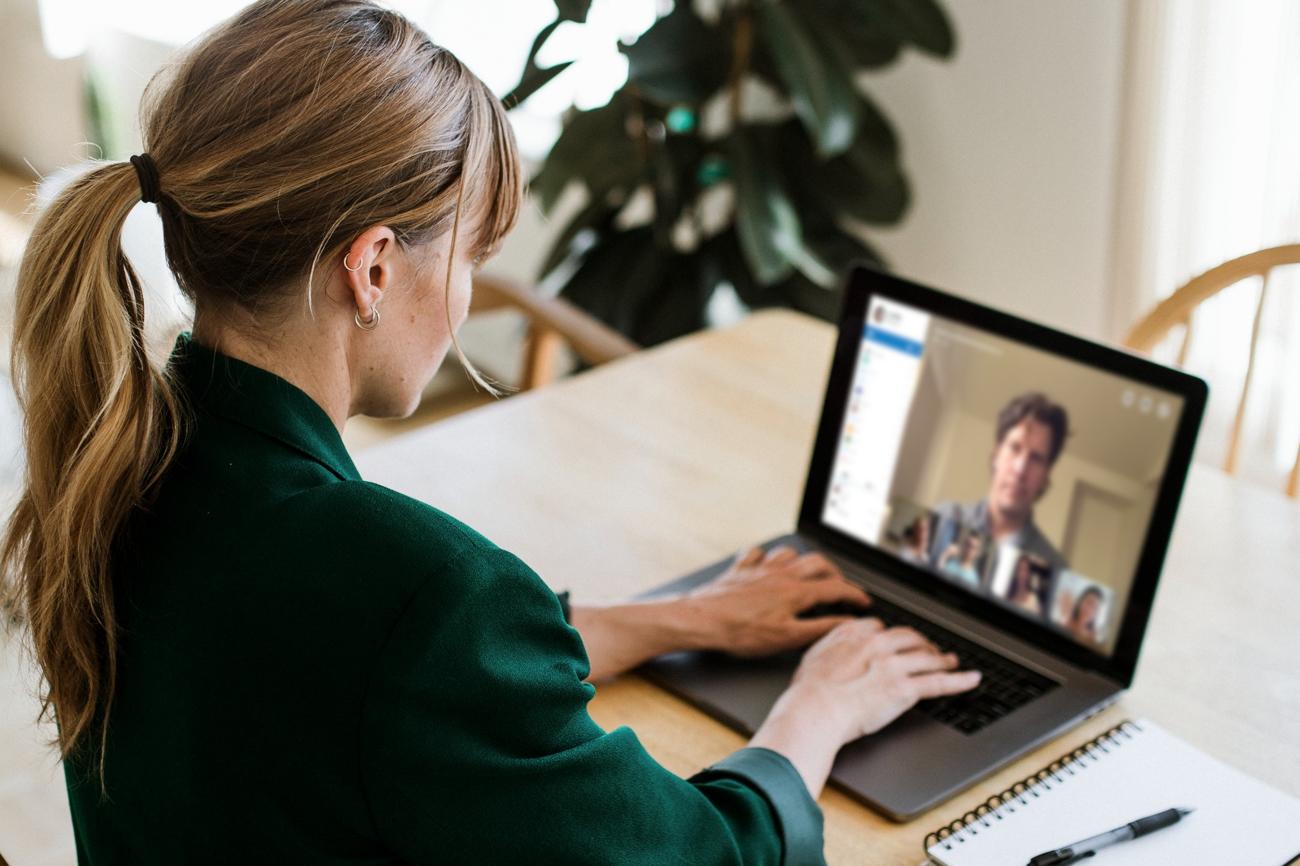 A person using a laptop for a video visit